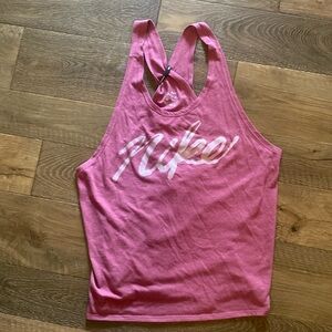 Berry colored Nike dri-fit split back running shirt